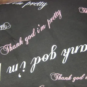 David and Goliath Thank God I'm Pretty on Black Cotton Jersey Fabric